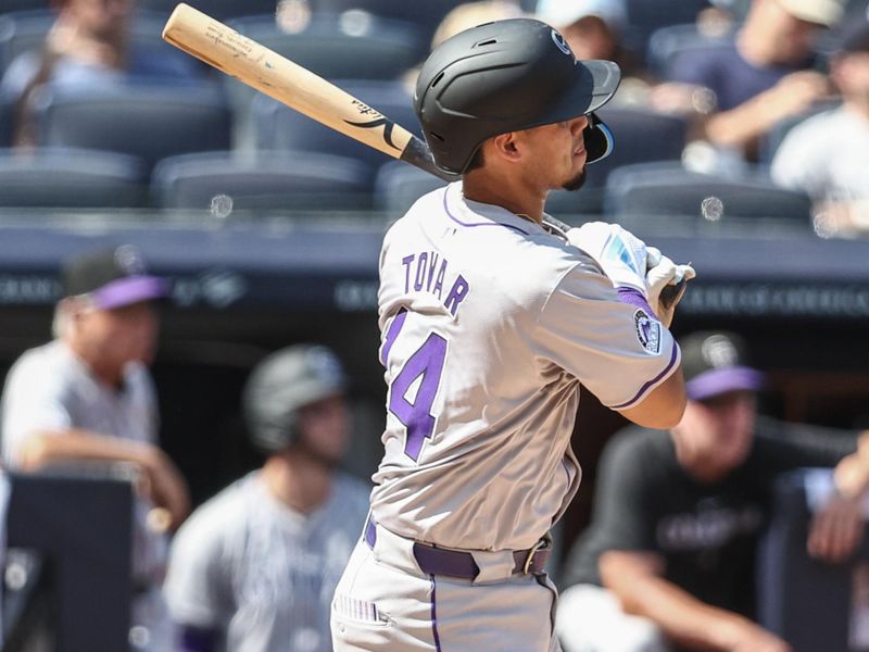 Aug 24, 2024; Bronx, New York, USA;  Colorado Rockies shortstop Ezequiel Tovar (14) hits a double in the third inning against the New York Yankees at Yankee Stadium. Mandatory Credit: Wendell Cruz-USA TODAY Sports