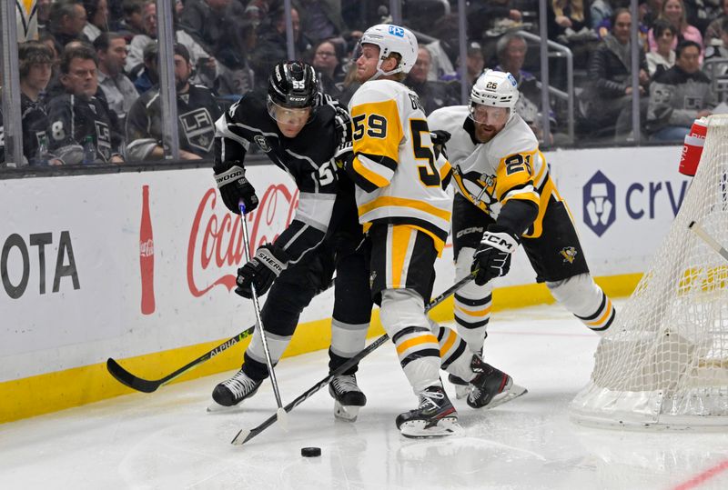 Feb 11, 2023; Los Angeles, California, USA;  Los Angeles Kings center Quinton Byfield (55) and Pittsburgh Penguins left wing Jake Guentzel (59) battle for the puck in the second period at Crypto.com Arena. Mandatory Credit: Jayne Kamin-Oncea-USA TODAY Sports