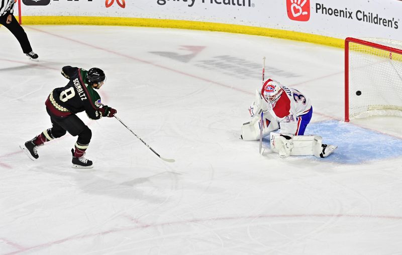 Nov 2, 2023; Tempe, Arizona, USA;  Arizona Coyotes center Nick Schmaltz (8) scores on Montreal Canadiens goaltender Jake Allen (34) during a penalty shot in the first period at Mullett Arena. Mandatory Credit: Matt Kartozian-USA TODAY Sports