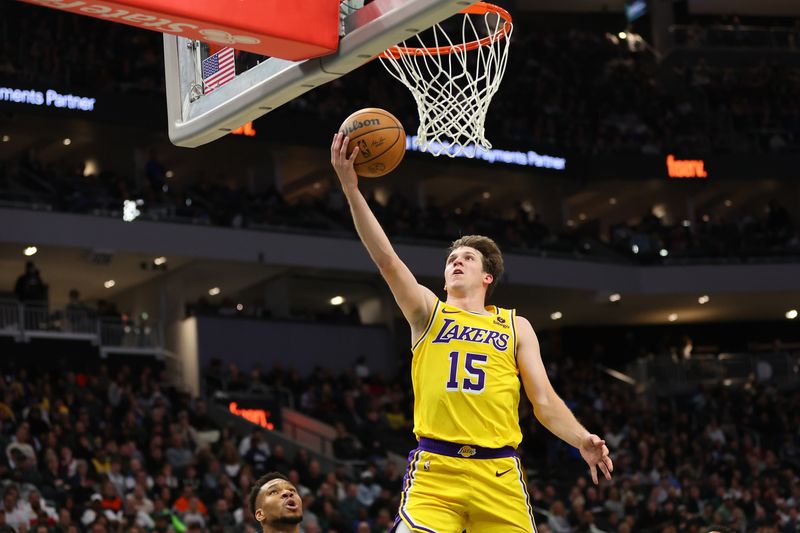 MILWAUKEE, WISCONSIN - MARCH 26: Austin Reaves #15 of the Los Angeles Lakers drives to the basket during the second half of a game against the Milwaukee Bucks at Fiserv Forum on March 26, 2024 in Milwaukee, Wisconsin. The Lakers defeated the bucks in double overtime. NOTE TO USER: User expressly acknowledges and agrees that, by downloading and or using this photograph, User is consenting to the terms and conditions of the Getty Images License Agreement. (Photo by Stacy Revere/Getty Images)