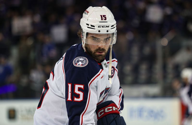 Jan 18, 2025; New York, New York, USA; Columbus Blue Jackets defenseman Dante Fabbro (15) warms up before the first period against the New York Rangers at Madison Square Garden. Mandatory Credit: Danny Wild-Imagn Images