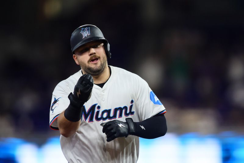 Sep 19, 2024; Miami, Florida, USA; Miami Marlins third baseman Jake Burger (36) circles the bases after hitting a solo home run against the Los Angeles Dodgers during the second inning at loanDepot Park. Mandatory Credit: Sam Navarro-Imagn Images