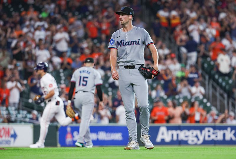 Jul 10, 2024; Houston, Texas, USA; Miami Marlins starting pitcher Bryan Hoeing (78) reacts and Houston Astros right fielder Joey Loperfido (10) rounds the bases after hitting a home run during the second inning at Minute Maid Park. Mandatory Credit: Troy Taormina-USA TODAY Sports