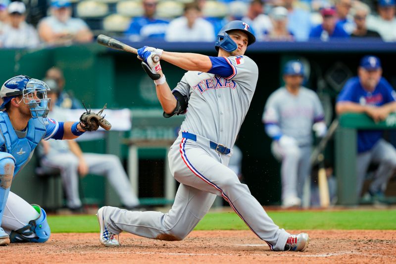 Aug 21, 2025; Kansas City, Missouri, USA; Texas Rangers shortstop Corey Seager (5) bats during the ninth inning against the Kansas City Royals at Kauffman Stadium. Mandatory Credit: Jay Biggerstaff-Imagn Images