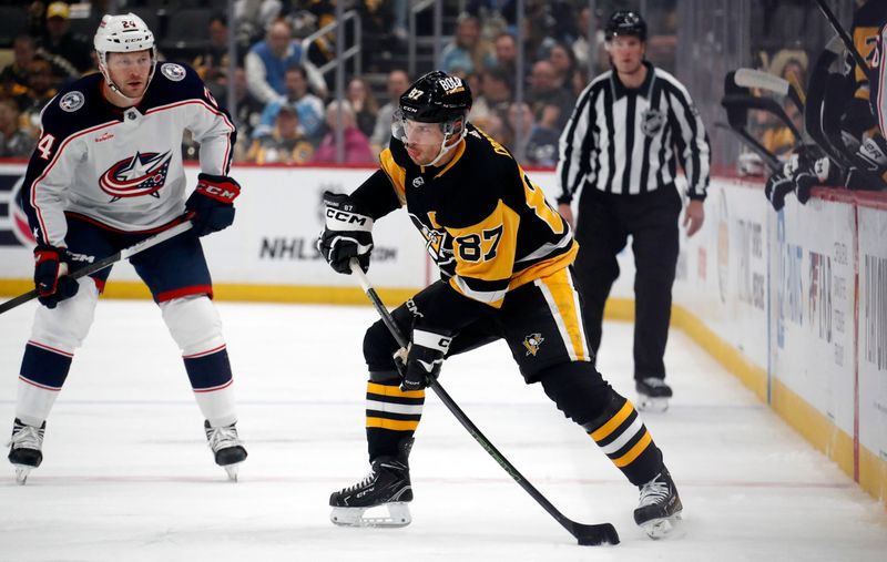 Mar 5, 2024; Pittsburgh, Pennsylvania, USA; Pittsburgh Penguins center Sidney Crosby (87) handles the puck ahead of Columbus Blue Jackets right wing Mathieu Olivier (24) during the first period at PPG Paints Arena. Mandatory Credit: Charles LeClaire-USA TODAY Sports