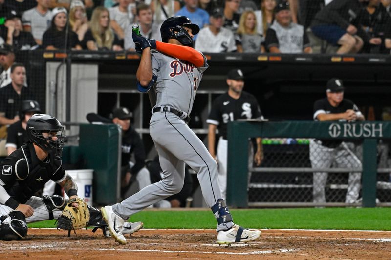 Sep 1, 2023; Chicago, Illinois, USA; Detroit Tigers center fielder Riley Greene (31) hits a two-run single against the Chicago White Sox during the fifth inning at Guaranteed Rate Field. Mandatory Credit: Matt Marton-USA TODAY Sports