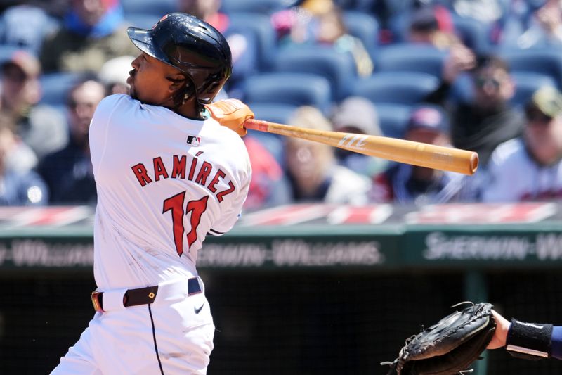 Apr 25, 2024; Cleveland, Ohio, USA; Cleveland Guardians designated hitter Jose Ramirez (11) hits a grand slam during the second inning against the Boston Red Sox at Progressive Field. Mandatory Credit: Ken Blaze-USA TODAY Sports