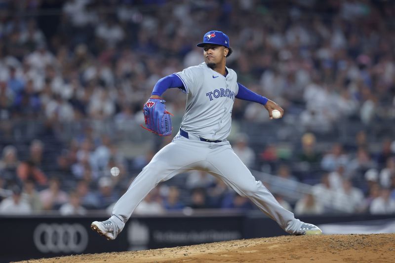 Aug 2, 2024; Bronx, New York, USA; Toronto Blue Jays relief pitcher Genesis Cabrera (92) pitches against the New York Yankees during the fifth inning at Yankee Stadium. Mandatory Credit: Brad Penner-USA TODAY Sports