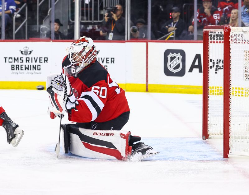 Sep 30, 2024; Newark, New Jersey, USA; New Jersey Devils goaltender Jeremy Brodeur (60) makes a save against the New York Rangers during the first period at Prudential Center. Mandatory Credit: Ed Mulholland-Imagn Images