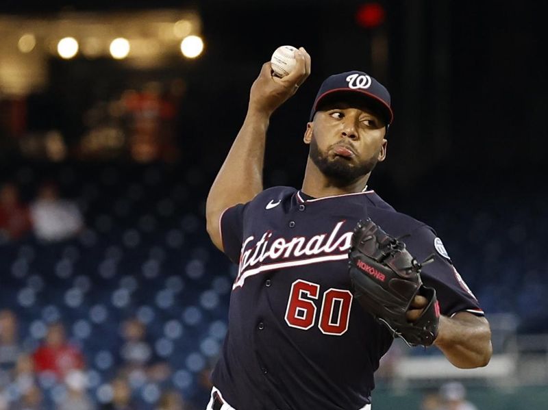 Sep 18, 2023; Washington, District of Columbia, USA; Washington Nationals starting pitcher Joan Adon (60) pitches against the Chicago White Sox during the first inning at Nationals Park. Mandatory Credit: Geoff Burke-USA TODAY Sports