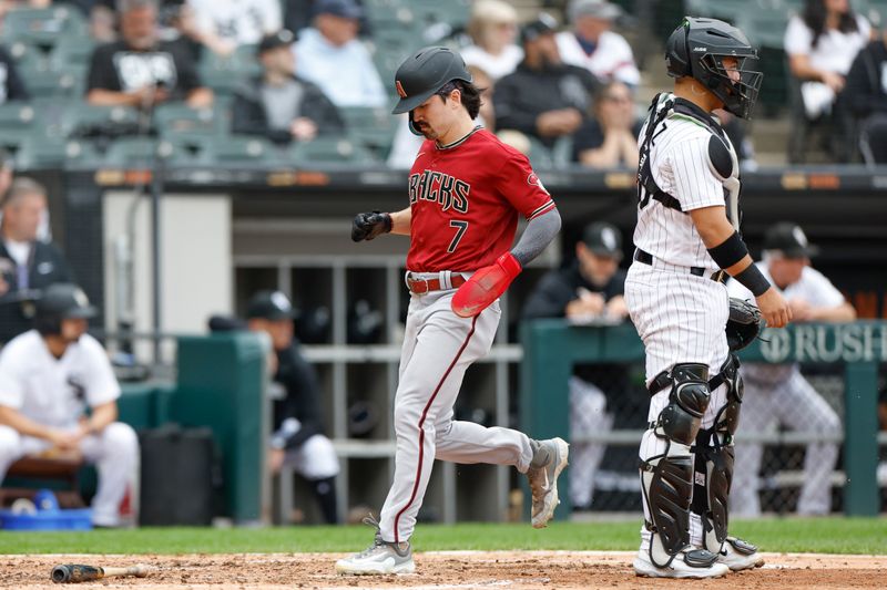 Sep 27, 2023; Chicago, Illinois, USA; Arizona Diamondbacks left fielder Corbin Carroll (7) scores against the Chicago White Sox during the third inning at Guaranteed Rate Field. Mandatory Credit: Kamil Krzaczynski-USA TODAY Sports