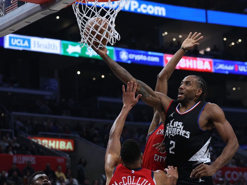 LOS ANGELES, CALIFORNIA - FEBRUARY 07: Kawhi Leonard #2 of the LA Clippers reacts as he is fouled on a his shot in front of np3#2, Herbert Jones #5 and Zion Williamson #1 of the New Orleans Pelicans during a 117-106 New Orleans Pelicans win at Crypto.com Arena on February 07, 2024 in Los Angeles, California. NOTE TO USER: User expressly acknowledges and agrees that, by downloading and/or using this Photograph, user is consenting to the terms and conditions of the Getty Images License Agreement. (Photo by Harry How/Getty Images)