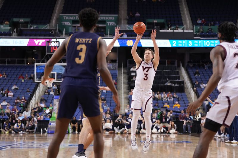 Mar 7, 2023; Greensboro, NC, USA; Virginia Tech Hokies guard Sean Pedulla (3) shoots as Notre Dame Fighting Irish guard Trey Wertz (3) defends in the second half at Greensboro Coliseum. Mandatory Credit: Bob Donnan-USA TODAY Sports