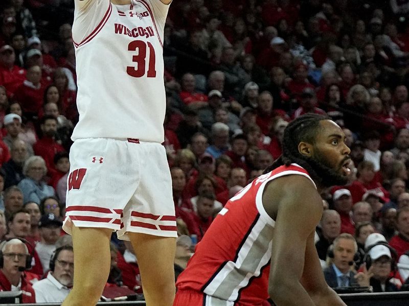 Feb 13, 2024; Madison, Wisconsin, USA;Wisconsin forward Nolan Winter (31) hits a three-point shot  during the second half of their game at the Kohl Center. Mandatory Credit: Mark Hoffman/Milwaukee Journal Sentinelf-USA TODAY Sports
