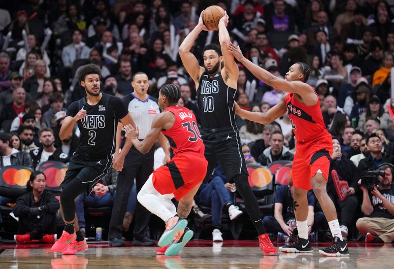 TORONTO, ON - JANUARY 1: Ben Simmons #10 of the Brooklyn Nets is guarded by Scottie Barnes #4 of the Toronto Raptors during the second half of their basketball game at the Scotiabank Arena on January 1, 2025 in Toronto, Ontario, Canada. NOTE TO USER: User expressly acknowledges and agrees that, by downloading and/or using this Photograph, user is consenting to the terms and conditions of the Getty Images License Agreement. (Photo by Mark Blinch/Getty Images)