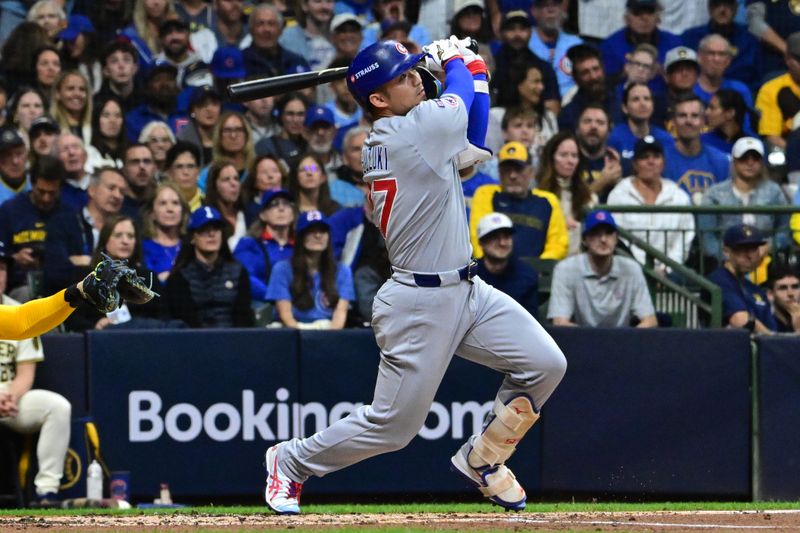 Oct 11, 2025; Milwaukee, Wisconsin, USA; Chicago Cubs right fielder Seiya Suzuki (27) hits a solo home run against the Milwaukee Brewers in the second inning during game five of the NLDS round for the 2025 MLB playoffs at American Family Field. Mandatory Credit: Benny Sieu-Imagn Images