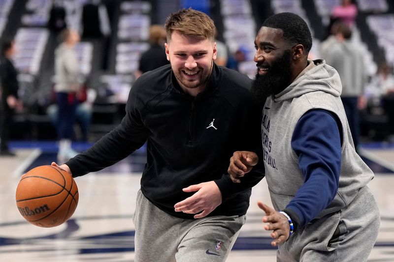 DALLAS, TEXAS - FEBRUARY 12: Luka Doncic #77 (L) of the Dallas Mavericks warms up before the game against the Washington Wizards at American Airlines Center on February 12, 2024 in Dallas, Texas. NOTE TO USER: User expressly acknowledges and agrees that, by downloading and or using this photograph, User is consenting to the terms and conditions of the Getty Images License Agreement. (Photo by Sam Hodde/Getty Images)