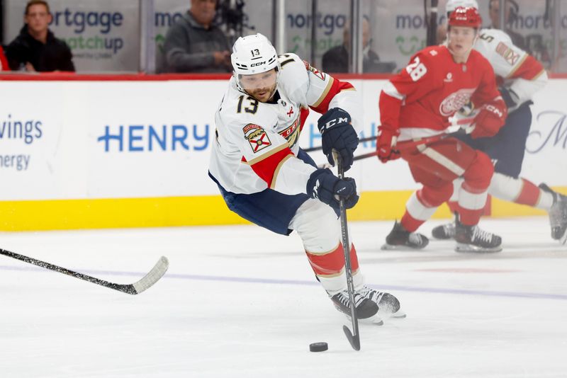 Oct 15, 2025; Detroit, Michigan, USA;  Florida Panthers center Sam Reinhart (13) skates with the puck in the first period against the Detroit Red Wings at Little Caesars Arena. Mandatory Credit: Rick Osentoski-Imagn Images