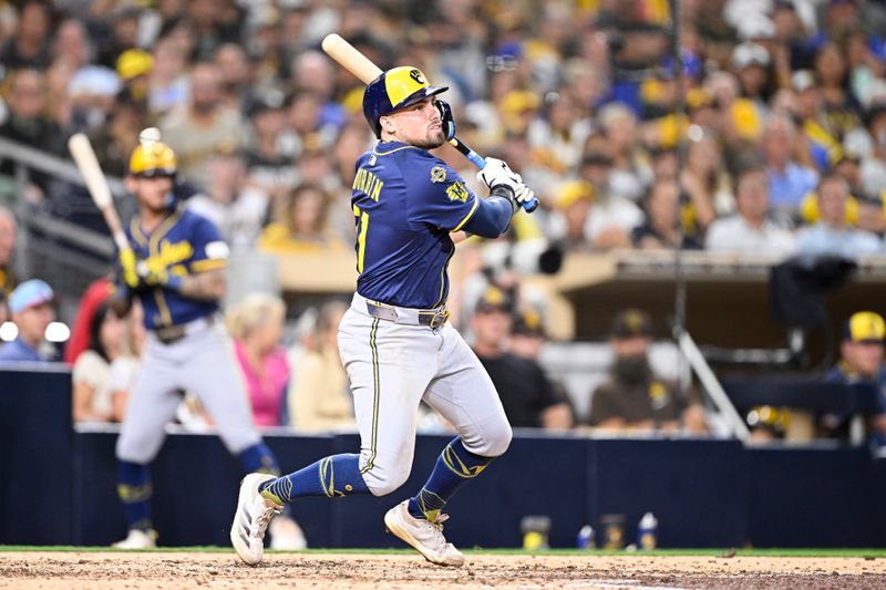 Sep 22, 2025; San Diego, California, USA; Milwaukee Brewers third baseman Caleb Durbin (21) hits a single during the eighth inning against the San Diego Padres at Petco Park. Mandatory Credit: Denis Poroy-Imagn Images