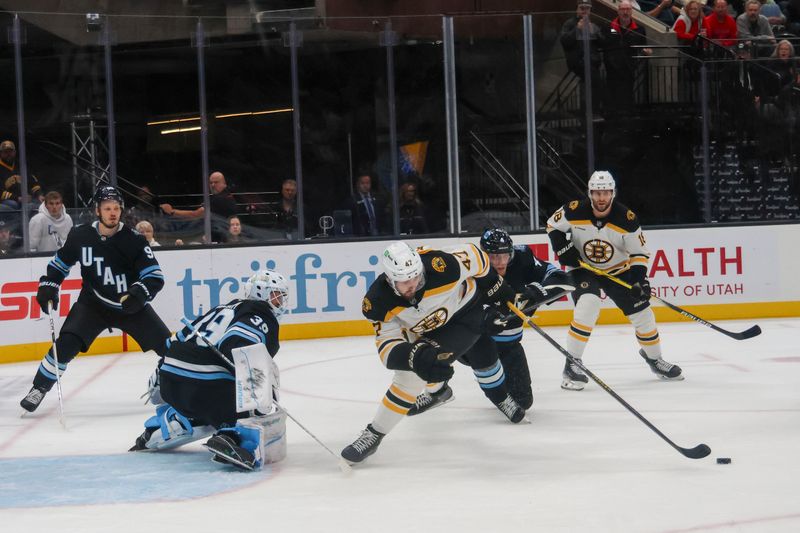 Oct 19, 2024; Salt Lake City, Utah, USA; Max Kastelic in front. Of Uta’s goalieat Delta Center. Mandatory Credit: Harry Caston-Imagn Images