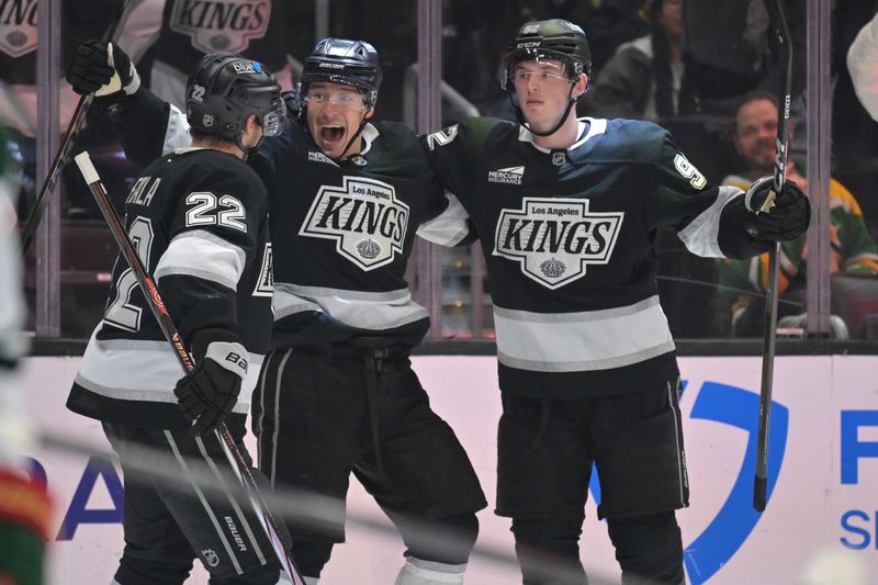 Jan 5, 2026; Los Angeles, California, USA;  Los Angeles Kings left wing Kevin Fiala (22) is congratulated by left wing Andrei Kuzmenko (96) and defenseman Brandt Clarke (92) after a goal in the second period against the Minnesota Wild at Crypto.com Arena. Mandatory Credit: Jayne Kamin-Oncea-Imagn Images