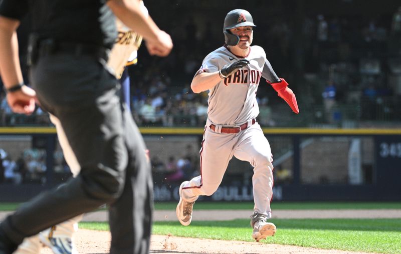 Jun 21, 2023; Milwaukee, Wisconsin, USA; Arizona Diamondbacks left fielder Corbin Carroll (7) runs to third base against the Milwaukee Brewers in the seventh inning at American Family Field. Mandatory Credit: Michael McLoone-USA TODAY Sports