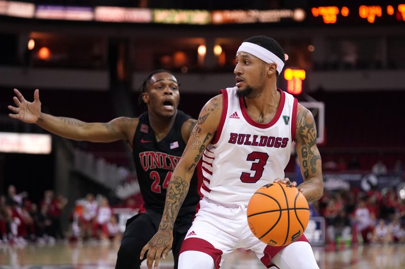 Feb 14, 2024; Fresno, California, USA; Fresno State Bulldogs guard Isaiah Hill (3) dribbles the ball in front of UNLV Rebels guard Jackie Johnson III (24) in the second half at the Save Mart Center. Mandatory Credit: Cary Edmondson-USA TODAY Sports