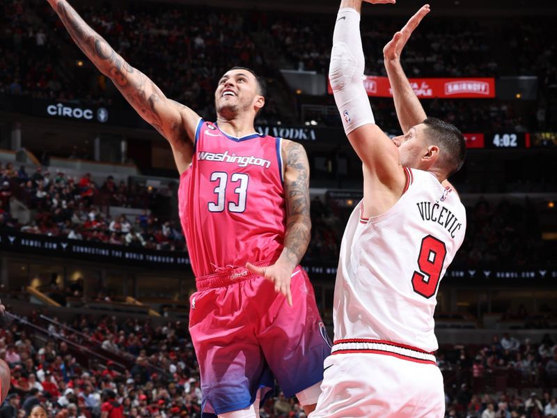 CHICAGO, IL - FEBRUARY 26: Kyle Kuzma #33 of the Washington Wizards drives to the basket during the game against the Chicago Bulls on February 26, 2023 at United Center in Chicago, Illinois. NOTE TO USER: User expressly acknowledges and agrees that, by downloading and or using this photograph, User is consenting to the terms and conditions of the Getty Images License Agreement. Mandatory Copyright Notice: Copyright 2023 NBAE (Photo by Jeff Haynes/NBAE via Getty Images)