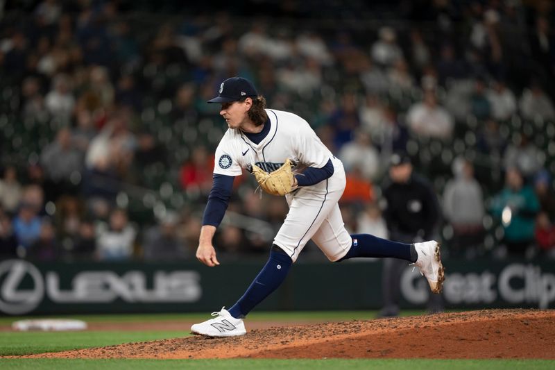 May 29, 2024; Seattle, Washington, USA; Seattle Mariners reliever Mike Baumann (53) delivers a pitch during the tenth inning against the Houston Astros at T-Mobile Park. Mandatory Credit: Stephen Brashear-USA TODAY Sports