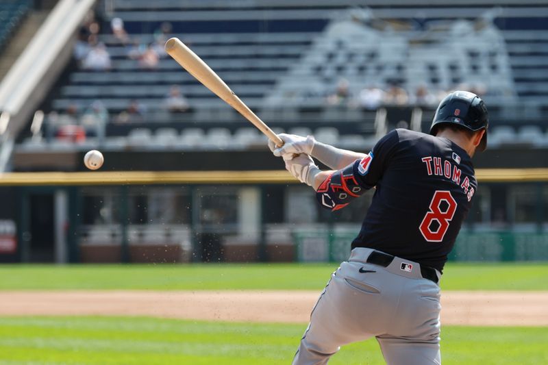 Sep 11, 2024; Chicago, Illinois, USA; Cleveland Guardians outfielder Lane Thomas (8) hits a two-run single against the Chicago White Sox during the first inning at Guaranteed Rate Field. Mandatory Credit: Kamil Krzaczynski-Imagn Images