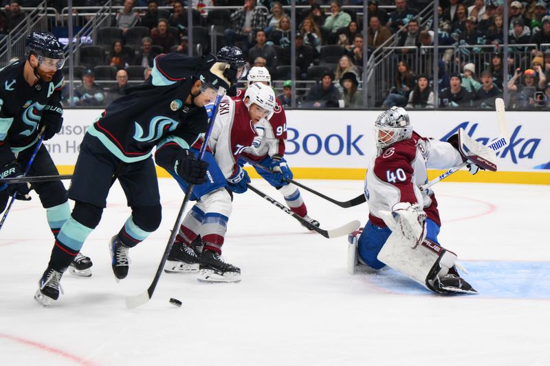 Nov 13, 2023; Seattle, Washington, USA; Seattle Kraken center Matty Beniers (10) shoots a goal shot against Colorado Avalanche goaltender Alexandar Georgiev (40) during the second period at Climate Pledge Arena. Mandatory Credit: Steven Bisig-USA TODAY Sports