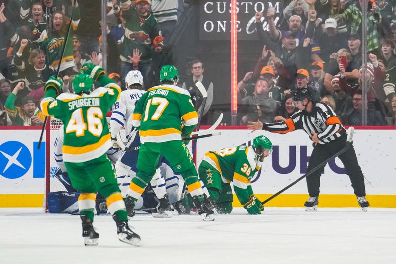 Nov 3, 2024; Saint Paul, Minnesota, USA; Minnesota Wild right wing Ryan Hartman (38) scores a goal during the first period against the Toronto Maple Leafs at Xcel Energy Center. Mandatory Credit: Brace Hemmelgarn-Imagn Images