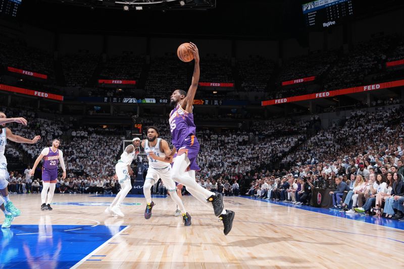 MINNEAPOLIS, MN -  APRIL 20: Kevin Durant #35 of the Phoenix Suns handles the ball during Round One Game One of the 2024 NBA Playoffs against the Minnesota Timberwolves on April 20, 2024 at Target Center in Minneapolis, Minnesota. NOTE TO USER: User expressly acknowledges and agrees that, by downloading and or using this Photograph, user is consenting to the terms and conditions of the Getty Images License Agreement. Mandatory Copyright Notice: Copyright 2024 NBAE (Photo by Jordan Johnson/NBAE via Getty Images)