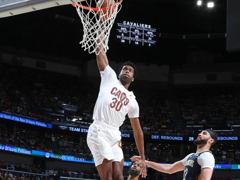 NEW ORLEANS, LA - MARCH 13: Damian Jones #30 of the Cleveland Cavaliers dunks the ball during the game against the New Orleans Pelicans on March 13, 2024 at the Smoothie King Center in New Orleans, Louisiana. NOTE TO USER: User expressly acknowledges and agrees that, by downloading and or using this Photograph, user is consenting to the terms and conditions of the Getty Images License Agreement. Mandatory Copyright Notice: Copyright 2024 NBAE (Photo by Layne Murdoch Jr./NBAE via Getty Images)