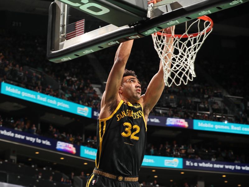 CHARLOTTE, NC - MARCH 29: Trayce Jackson-Davis #32 of the Golden State Warriors  drives to the basket during the game against the Charlotte Hornets on March 29, 2024 at Spectrum Center in Charlotte, North Carolina. NOTE TO USER: User expressly acknowledges and agrees that, by downloading and or using this photograph, User is consenting to the terms and conditions of the Getty Images License Agreement. Mandatory Copyright Notice: Copyright 2024 NBAE (Photo by Kent Smith/NBAE via Getty Images)