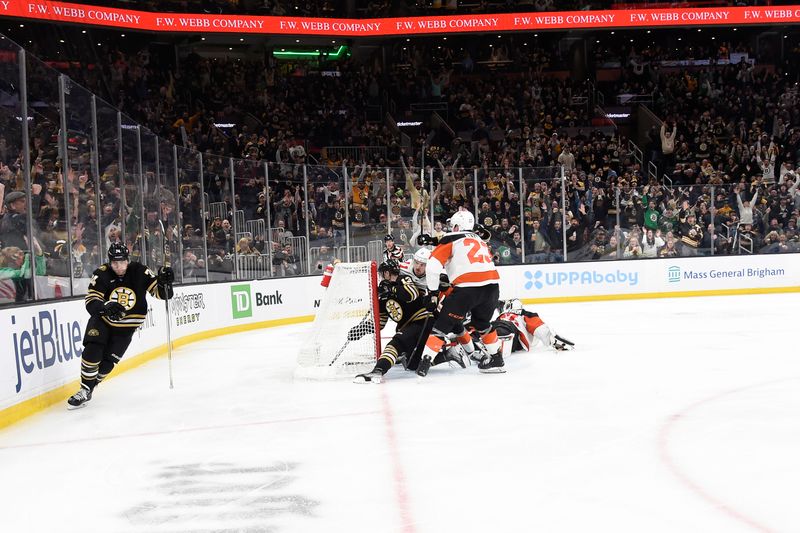 Mar 16, 2024; Boston, Massachusetts, USA; Boston Bruins left wing Jake DeBrusk (74) reads after scoring a goal during the third period against the Philadelphia Flyers at TD Garden. Mandatory Credit: Bob DeChiara-USA TODAY Sports