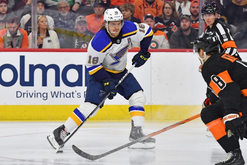 Mar 4, 2024; Philadelphia, Pennsylvania, USA; St. Louis Blues center Robert Thomas (18) soots the puck against the Philadelphia Flyers during the first period at Wells Fargo Center. Mandatory Credit: Eric Hartline-USA TODAY Sports