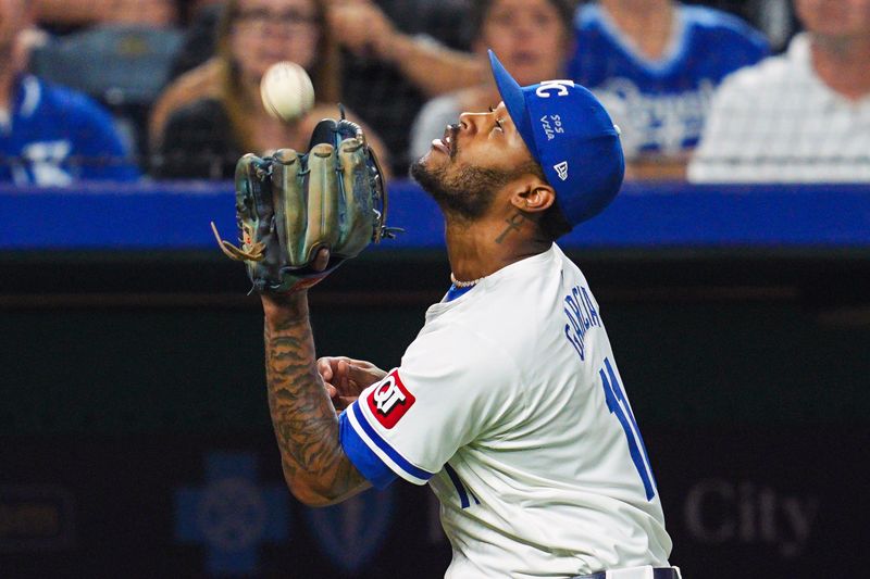 Aug 21, 2024; Kansas City, Missouri, USA; Kansas City Royals third baseman Maikel Garcia (11) catches a fly ball ball during the seventh inning against the Los Angeles Angels at Kauffman Stadium. Mandatory Credit: Jay Biggerstaff-USA TODAY Sports