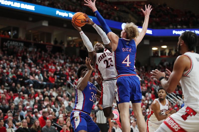 Jan 3, 2023; Lubbock, Texas, USA;  Texas Tech Red Raiders guard De Vion Harmon (23) shoots over Kansas Jayhawks guard Gradey Dick (4) in the first half at United Supermarkets Arena. Mandatory Credit: Michael C. Johnson-USA TODAY Sports