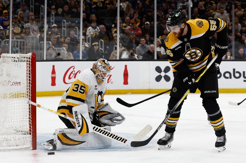 Nov 29, 2024; Boston, Massachusetts, USA; Pittsburgh Penguins goaltender Tristan Jarry (35) makes a save on a deflection by Boston Bruins right wing Justin Brazeau (55) during the first period at TD Garden. Mandatory Credit: Winslow Townson-Imagn Images