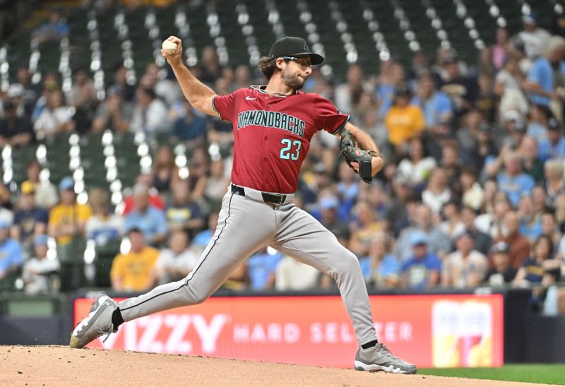 Sep 20, 2024; Milwaukee, Wisconsin, USA; Arizona Diamondbacks pitcher Zac Gallen (23) delivers a pitch against the Milwaukee Brewers in the first inning  at American Family Field. Mandatory Credit: Michael McLoone-Imagn Images