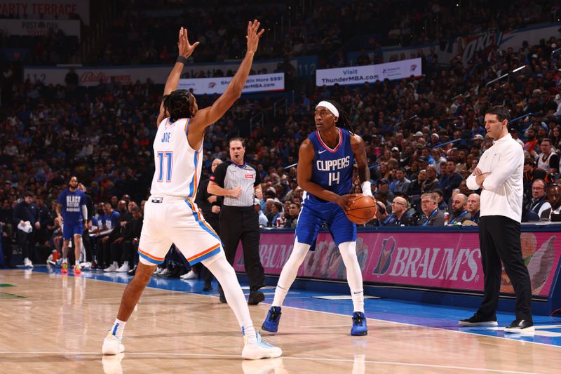 OKLAHOMA CITY, OK - FEBRUARY 22: Terance Mann #14 of the LA Clippers handles the ball during the game against the Oklahoma City Thunder on February 22SF, 2024 at Paycom Arena in Oklahoma City, Oklahoma. NOTE TO USER: User expressly acknowledges and agrees that, by downloading and or using this photograph, User is consenting to the terms and conditions of the Getty Images License Agreement. Mandatory Copyright Notice: Copyright 2024 NBAE (Photo by Zach Beeker/NBAE via Getty Images)