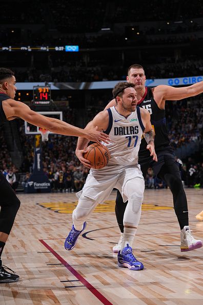 DENVER, CO - DECEMBER 18: Luka Doncic #77 of the Dallas Mavericks handles the ball during the game against the Denver Nuggets on December 18, 2023 at the Ball Arena in Denver, Colorado. NOTE TO USER: User expressly acknowledges and agrees that, by downloading and/or using this Photograph, user is consenting to the terms and conditions of the Getty Images License Agreement. Mandatory Copyright Notice: Copyright 2023 NBAE (Photo by Bart Young/NBAE via Getty Images)