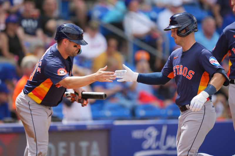 Mar 23, 2024; Port St. Lucie, Florida, USA;  Houston Astros third baseman Alex Bregman, right, celebrates his second three-run home run against the New York Mets with left fielder Chas McCormick, left, in the fourth inning at Clover Park. Mandatory Credit: Jim Rassol-USA TODAY Sports