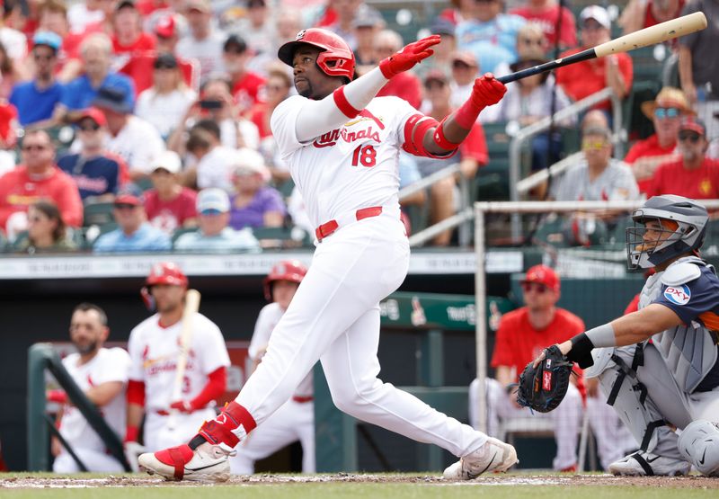 Mar 7, 2024; Jupiter, Florida, USA; St. Louis Cardinals right fielder Jordan Walker (18) follows through on his home run against the Houston Astros in the second inning at Roger Dean Chevrolet Stadium. Mandatory Credit: Rhona Wise-USA TODAY Sports