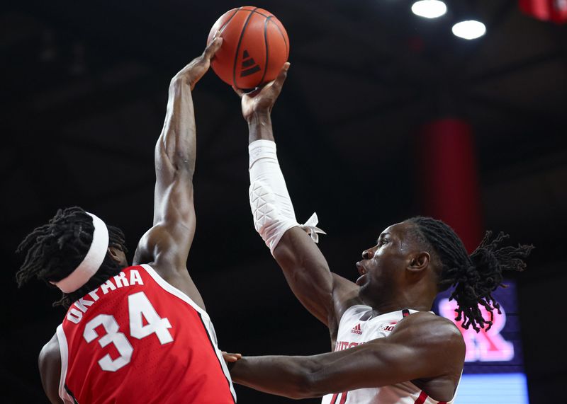 Mar 10, 2024; Piscataway, New Jersey, USA; Ohio State Buckeyes center Felix Okpara (34) blocks a shot by Rutgers Scarlet Knights center Clifford Omoruyi (11) during the second half at Jersey Mike's Arena. Mandatory Credit: Vincent Carchietta-USA TODAY Sports