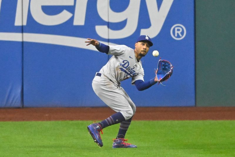 Aug 23, 2023; Cleveland, Ohio, USA; Los Angeles Dodgers right fielder Mookie Betts (50) makes a catch in the first inning against the Cleveland Guardians at Progressive Field. Mandatory Credit: David Richard-USA TODAY Sports