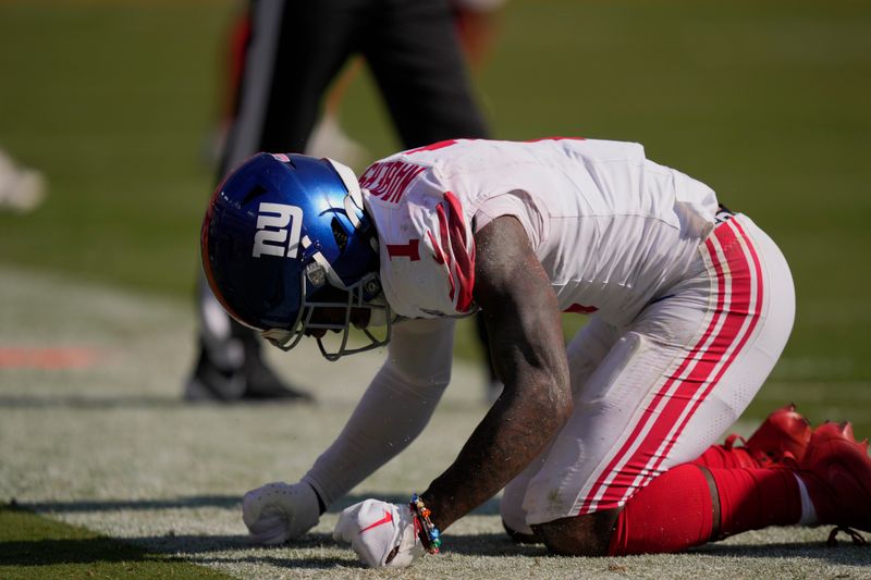 New York Giants wide receiver Malik Nabers (1) reacts after missing a pass on fourth down against the Washington Commanders during the second half of an NFL football game in Landover, Md., Sunday, Sept. 15, 2024. (AP Photo/Matt Slocum)