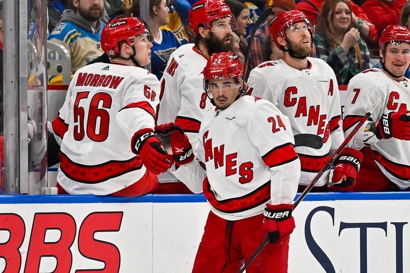 Apr 12, 2024; St. Louis, Missouri, USA;  Carolina Hurricanes center Seth Jarvis (24) is congratulated by teammates after scoring against the St. Louis Blues during the second period at Enterprise Center. Mandatory Credit: Jeff Curry-USA TODAY Sports