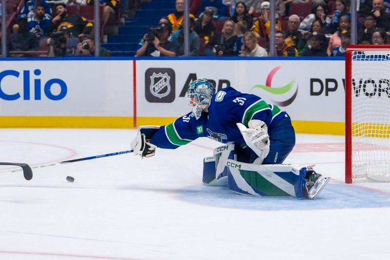 Sep 24, 2024; Vancouver, British Columbia, CAN; Vancouver Canucks goalie Arturs Silovs (31) makes a save against the Seattle Kraken during the second period at Rogers Arena. Mandatory Credit: Bob Frid-Imagn Images